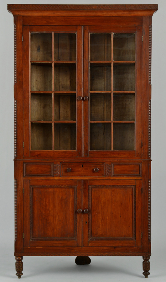 Southern furniture showed strength. This cherry corner cupboard, illustrated in 'The Art and Mystery of Tennessee Furniture,' tripled its estimate at $13,455. Case Antiques image.