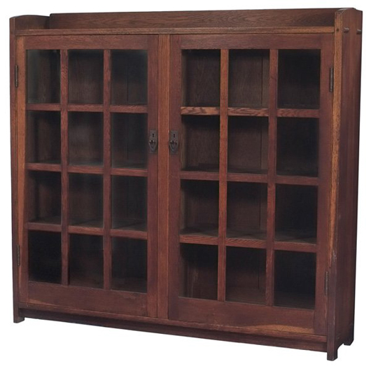 Gustav Stickley bookcase no. 719 with 12 glass panels, hand-hammered hardware and thrrough-tenon construction. Image courtesy of LiveAuctioneers.com and Treadway Gallery.