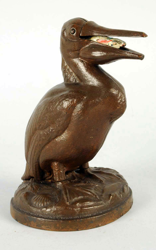 Trenton Lock and Hardware Company cast-iron mechanical bank ‘Pelican with Rabbit,’ patented 1878, $15,600. Morphy Auctions image.