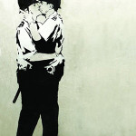 Banksy, 'Kissing Coppers,' Brighton, ca. 2005, spray paint and stencil on emulsion base with aluminum. Image courtesy of LiveAuctioneers.com archive and Fine Art Auctions Miami