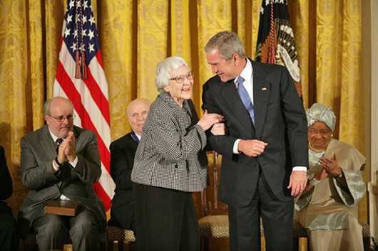 President George W. Bush awards the Presidential Medal of Freedom to author Harper Lee during a ceremony Nov. 5, 2007. White House photo by Eric Draper. Image courtesy of Wikimedia Commons.