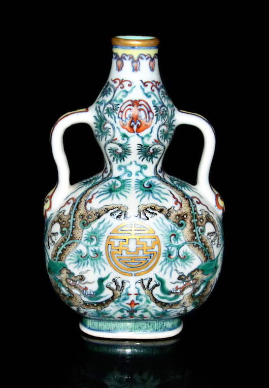 Doucai dragon double-gourd flask of compressed form, with bat medallion below a gilt rim and a Shou symbol defined by descending dragons in an overall pattern of feathery foliage on undulating stems. Lot 185. Estimate: $500,000-$800,000. Gianguan Auctions image.