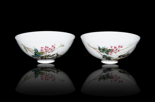 A pair of Qing Dynasty Famille Rose floral bowls with grasshoppers amid blossoms on one and pea pods on the other. Each is inscribed with a poem. Lot 190. Estimate: $1,000,000-$1,500,000. Gianguan Auctions image.