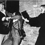 Actor Mickey Hargitay, the husband of actress Jayne Mansfield, scuffles with 'the king of paparazzi' Rino Barillari, while model Vatussa Vitta hits him with her purse, in a 1963 photo taken in Rome. This file is licensed under the Creative Commons Attribution-Share Alike 3.0 Unported license.