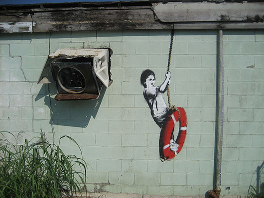 'Swinger,' one of the Banksy murals in New Orleans. Image by Infrogmation of New Orleans. This file is licensed under the Creative Commons Attribution 2.0 Generic license.