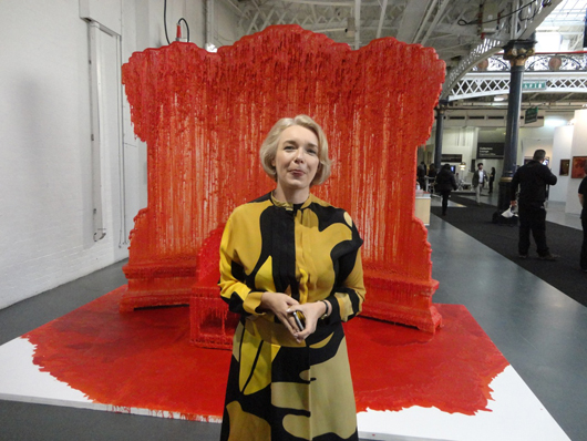 ART14 London fair director Stephanie Dieckvoss poses for Auction Central News in front of Chinese artist Zhao Zhao’s installation ‘Waterfall’ at the fair’s VIP evening on Feb. 27. Image Auction Central News.
