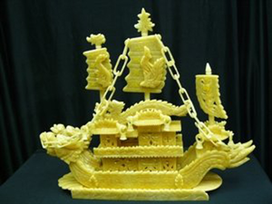 24in yellow antique jade dragon boat, authentic jade, all handmade. Est. $475-$650. U.S. Auction Gallery image. 
