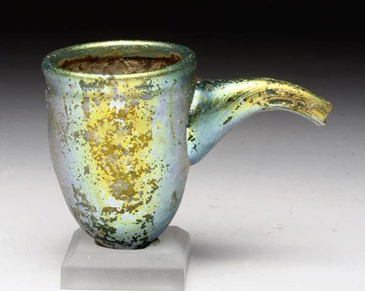 Lot 54: stunning Roman glass baby feeder, circa A.D 0-100. Estimate: $900-$1,200. Artemis Gallery LIVE image.