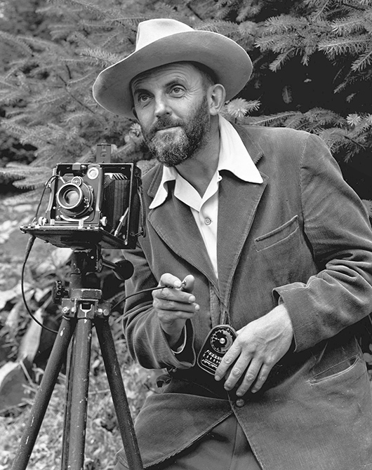 Photo portrait of photographer Ansel Adams (1902-1984), which first appeared in the 1950 'Yosemite Field School' yearbook. Image by Malcolm Greany. Image courtesy of Wikimedia Commons.