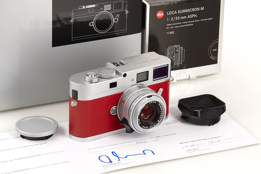 Unique chrome Monochrom 'Ralph Gibson' edition Leica with red signature on top plate and red leather covering. Westlicht image.