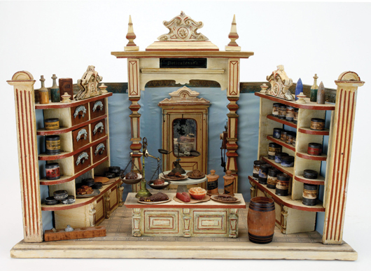 Gottschalk Delicatessen, late 19th century, painted wood and composition shop with miniature labeled tins and composition food items (accessories to be auctioned separately). Est. $2,500-$3,500. Noel Barrett Auctions image.