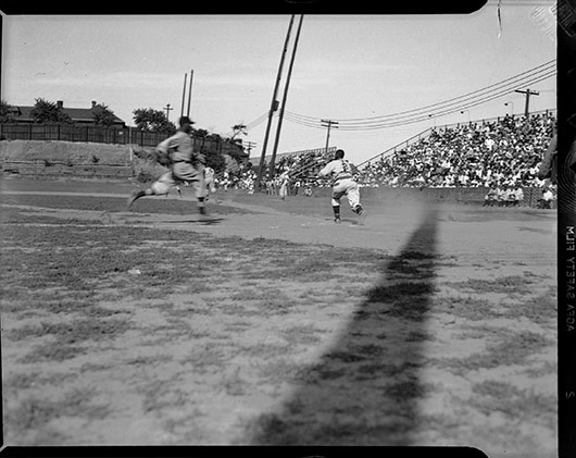 Charles ‘Teenie’ Harris; baserunner, possibly Homestead Grays baseball player, approaching home plate while catcher, uniform no. 2, awaits throw, during baseball game at Greenlee Field, circa 1938; Heinz Family Fund, 2001.35.3154 © 2006 Charles ‘Teenie’ Harris Archive, Carnegie Museum of Art, Pittsburgh.
