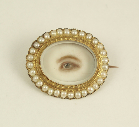 Eye miniature brooch, ca. 1845, artist unknown, watercolor on ivory, gold, pearls, glass. Collection of Cathy Gordon. Photo Credit: Courtesy of Cathy Gordon.