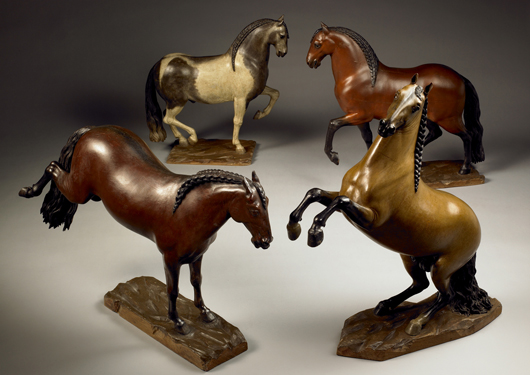 Four Spanish horses in polychromed wood by Juan Chaéz, priced in the region of €350,000 ($482,350) for the set, on the stand of Tomasso Brothers at TEFAF. Image courtesy Tomasso Brothers.