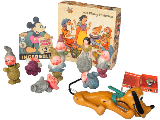 Selection of Disney items, including (left to right) Ingersoll $2 watch standee with attached Mickey Mouse watch, boxed set of Snow White and Seven Dwarfs figures, Pluto marionette, boxed Mickey Mouse watch.