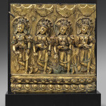 From: Oliver Forge / Brendan Lynch, a 15th century gilt bronze plaque depicting four offering goddesses, from the Tibetan Dentasil Monastery. Asia Week New York image.