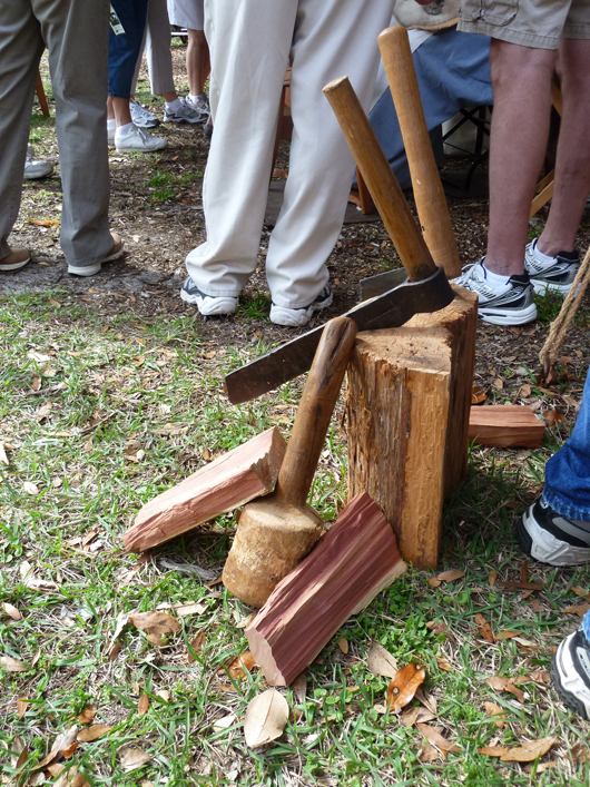 The ‘beetle’ is the round wooden mallet used to drive the froe, lodged in the wood. The split pieces of wood are called ‘bolts.’