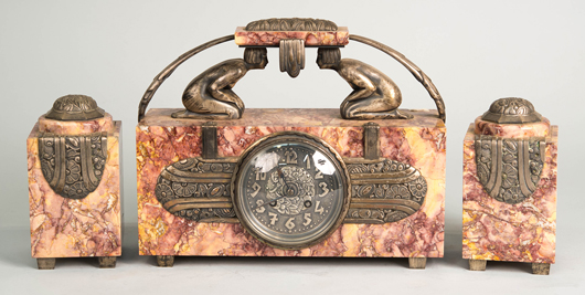 Art Deco 3-piece figural bronze-mounted rouge marble clock garniture. Est. $800-$1,200. Grogan & Co. image  