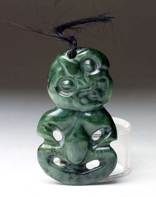 Lot 289: Maori greenstone Hei Tiki amulet, mid-20th century. Est. 400-$600, start $200. Artemis Gallery Live image.