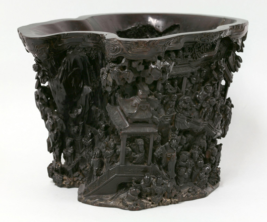 Exceptional zitan 'Hundred Boys' large brush pot, late 18th/early 19th century, deeply carved with numerous small figures at various pursuits on a rocky mountainside below clouds. Estimate: £20,000-£30,000. Sworders Fine Art Auctioneers image.