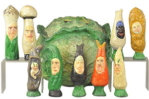 These small vegetable figures fit into a 13-inch-high papier-mache cabbage-shape box. It's a child's skittles set that sold for $4,425 at a 2013 Bertoia toy auction in Vineland, N.J.