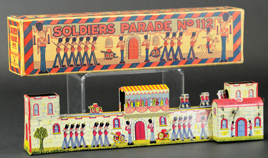 Henry Katz Soldiers’ Parade lithographed tin wind-up toy with original box, sold for $3,540. Bertoia Auctions image