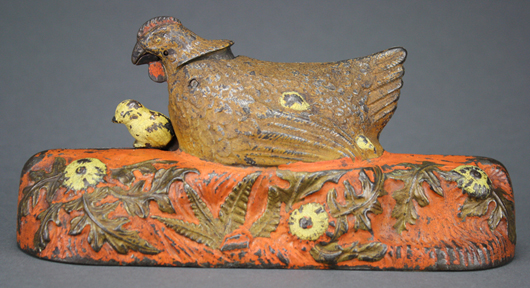 The Bill Robison collection features very rare and desirable color variations. This orange-base Hen and Chick bank is a unique example. RSL Auction Co. image