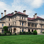 The most famous structure within Bellevue Avenue's National Historic Landmark District in Newport is The Breakers, the summer home of Cornelius Vanderbilt II, located in Newport, Rhode Island, United States. It was built in 1893, added to the National Register of Historic Places in 1971, and designated a National Historic Landmark in 1994. Photo by Matt H. Wade, a k a UpstateNYer, and is licensed under the Creative Commons Attribution-Share Alike 3.0 Unported license.