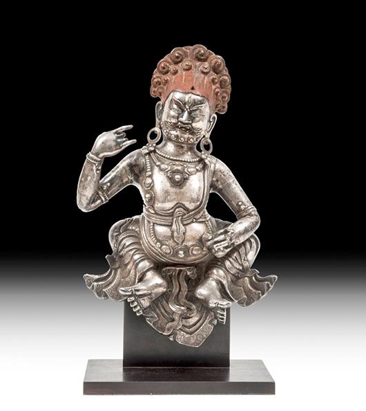 Sino-Tibetan 18th century cast silver and repousse metalwork figure of Jambhala the Tibetan wealth deity. Estimate: £4,000-£6,000. Dreweatts & Bloomsbury Auctions image.