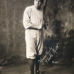 Babe Ruth, full-length portrait in New York Yankees baseball uniform, 1920, with facsimile signature. Image is in the public domain in the United States because it was published (or registered with the US Copyright Office before January 1, 1923. Source: United States Library of Congress's Prints and Photographs division.