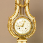 Tiffany Louis XIV bronze and marble clock, porcelain dial signed Tiffany & Co. New York, Paris, time and bell strike, works signed Tiffany, 30-day movement, circa 1880, 18 inches high. Estimate: $3,800-$5,500. Bruhns Auction Gallery image.