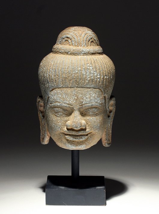 Khmer carved stone Buddha head, circa 12th-14th century. Estimate: $1,000-$1,500. Artemis Gallery Live image.