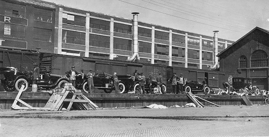 This circa 1910 photo shows workers preparing Studebaker automobiles prior to shipping on the company’s Main Street rail dock. Studebaker buildings #47 and #48 are visible in the background. They were torn down in the late 1980s. Image courtesy of Studebaker National Museum.