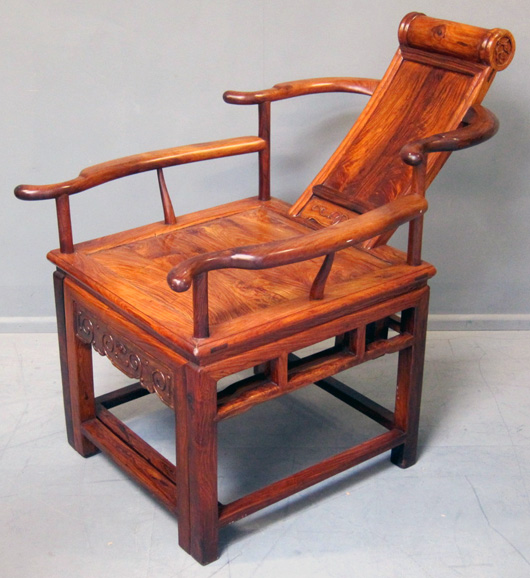 Twentieth 20th Chinese carved huanghuali chair with reclining back, and carved with a Shou character. Estimate: £1,000-£1,500. Ewbank's image.
