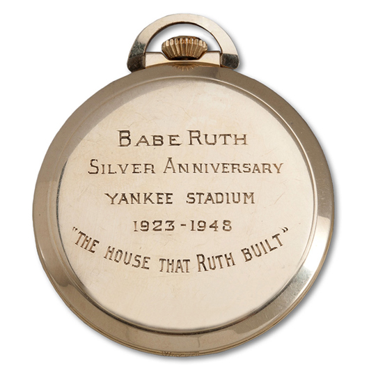 The inscription on the back of the pocket watch commemorating the 25th anniversary of the opening of Yankee Stadium in the Bronx. Image courtesy of SCP Auctions.