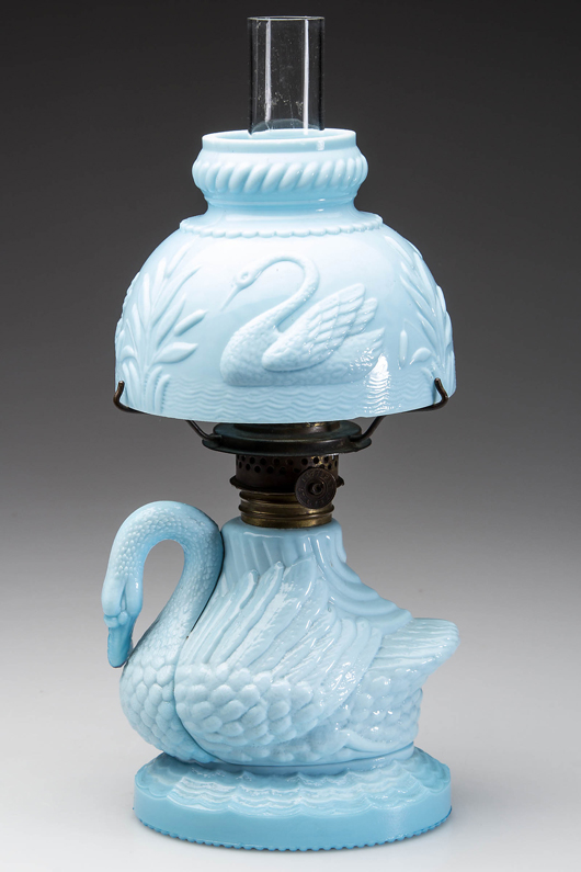 Swan figural miniature lamp, rare blue milk glass with matching shade. Estimate: $2,000-$3,000. Jeffrey S. Evans & Associates images.