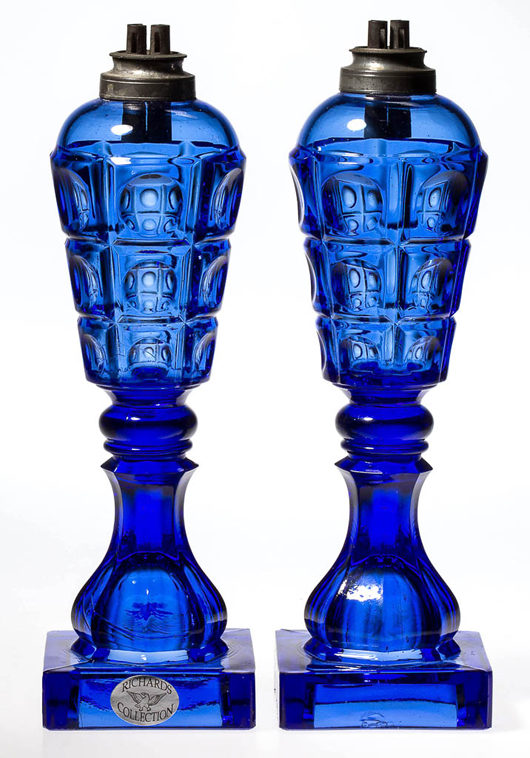 A pair of pressed Three-Printie Block whale oil lamps in brilliant sapphire blue made at the Boston & Sandwich Glass Co. around 1850 sold for $6,325 (lot 258). Jeffrey S. Evans & Associates image.