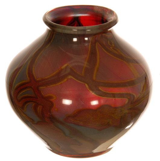 Signed Tiffany Favrile red paperweight vase, bulbous in shape and standing 4 inches tall. Price realized: $36,000. Woody Auction image.