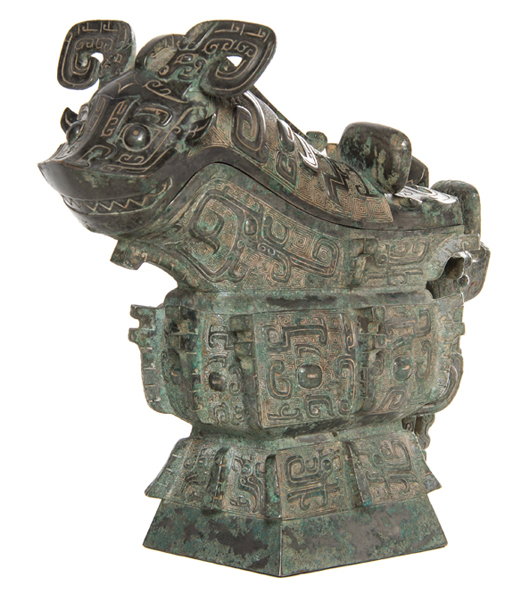 Chinese bronze ritual gong vessel having a fitted cover depicting a horned beast. Price realized: $722,500. Leslie Hindman Auctioneers image.