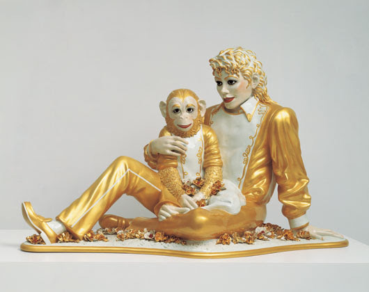 Jeff Koons' (American, b. 1955-) 'Banality' series culminated in 1988 with 'Michael Jackson and Bubbles,' a series of three life-size gold-leaf-planted porcelain statues of the singer cuddling his pet chimpanzee, Bubbles. One of the three is included in the Whitney Museum of American Art's 'Jeff Koons: A Retrospective,' which opens on June 27, 2014. Image courtesy of Whitney Museum of American Art.