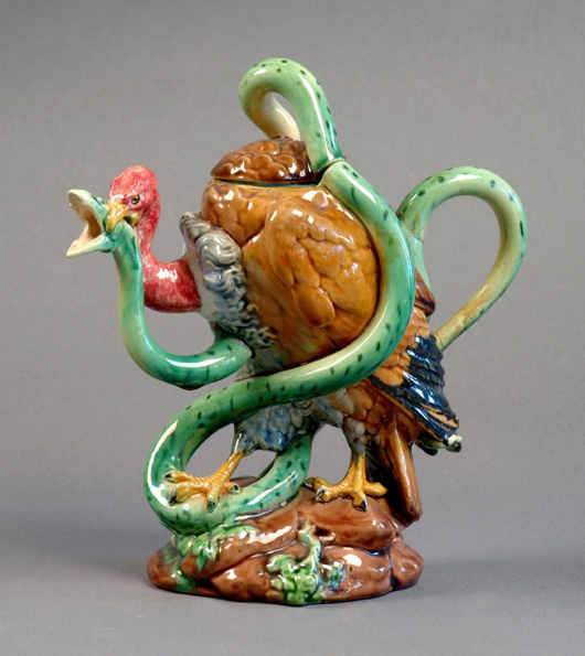 A Minton teapot modeled as a vulture attacking a serpent. It sold for £17,000.