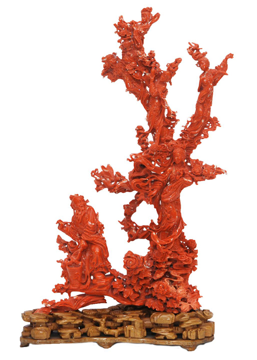 Intricately carved Chinese red coral figural group depicting a family tree, 15 1/2 inches tall. Price realized: $90,750. Elite Decorative Arts image.