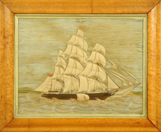 A 19th-century handworked sailor's woolwork, three-masted sailing vessel in full rig in choppy sea with figures on land to right hand corner, circa 1870. 16 in x 21 in, in maple frame. Sold for £380