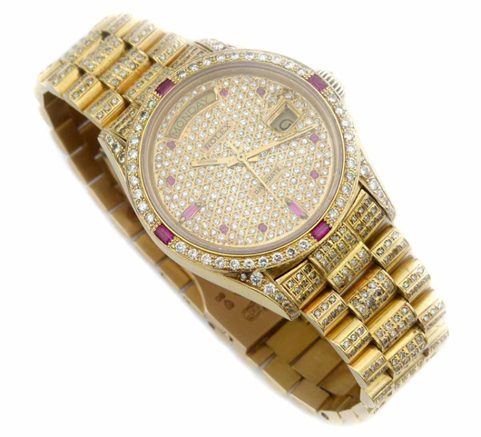 Diamond and ruby encrusted gold Rolex President wristwatch, est. £5,000-£7,000. Peter Wilson image