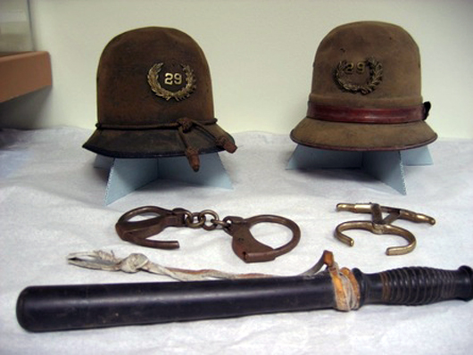 Fascinating displays include antique hats, handcuffs, nightsticks and many other law-enforcement memorabilia. Portland Police Museum image