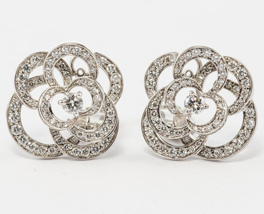 Chanel ‘Camellia’ 18K white gold earclips, each with a brilliant-cut central diamond and diamond-studded openwork ‘petal’ surround. Total diamond weight: 1.60cts. Auction Zero image
