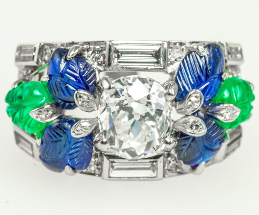 Cartier platinum Tutti Frutti 2.12-carat cushion-shape diamond, carved sapphire and emerald leaves accented by baguette- and circular-cut diamonds. Gross weight 11.7 grams. Auction Zero image