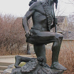 'Kitchi Zibi Omamiwinini,' statue depicting Anishinaabe scout/guide by Hamilton MacCarthy, 1918, Major's Hill Park, Ottawa, Ontario, Canada. Was once at the base of a statue to Samuel de Champlain at Nepean Point, Ottawa. Renamed in 2013 by Algonquin Anishinabe elder Annie Smith St. Georges. Photo by D. Gordon E. Robertson, licensed under the Creative Commons Attribution-Share Alike 3.0 Unported license.