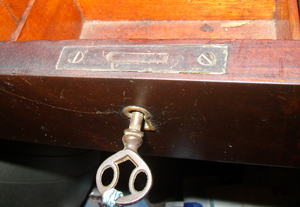 A full mortise lock is completely enclosed in the wood with only the selvage visible.