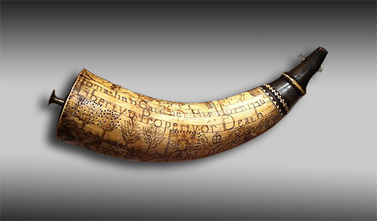 This is not the powder horn in question, but it is another fine example of a hand-engraved early American horn. This one, carved by Jonathan Gardner in 1776, is part of the permanent collection at the Concord Mass Museum. Photo by Victorgrigas, licensed under under the Creative Commons CC0 1.0 Universal Public Domain Dedication